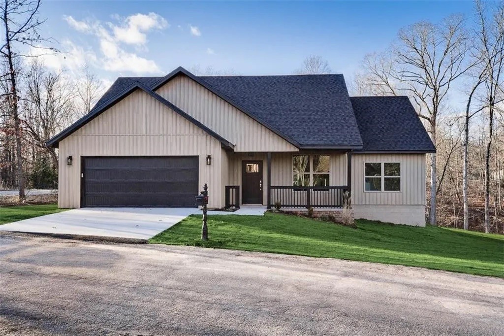 Beautiful 2022 built home on a level lot in Bella Vista. Only minutes from the Loch Lomond boat dock and easy access to the new Bella Vista bypass & Sugar Creek Trails! 1,628 Sqft home features 3 BD's / 2 BA's, custom cabinets, quartz counters, gas range, luxury vinyl plank flooring, and tile shower.