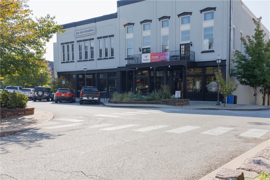 Prime downtown Fayetteville location steps from the Historic Square! This charming commercial space at 21 W Mountain Street offers unbeatable visibility, steady foot traffic, and proximity to popular restaurants, boutiques, and the Farmers Market. There are multiple private offices and conference rooms in the same space.