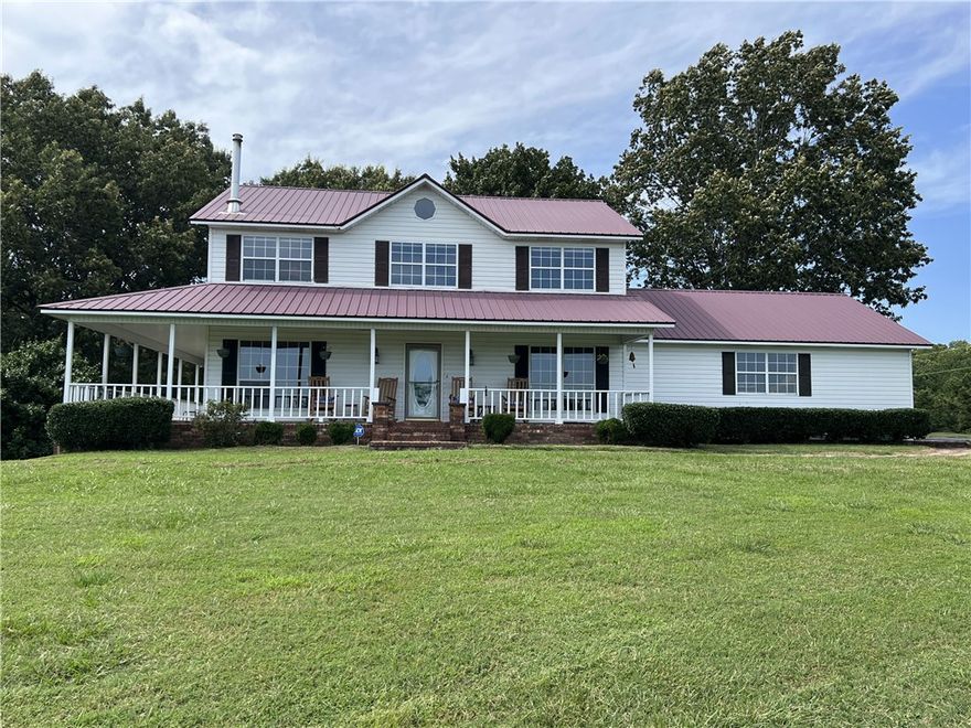 Premier Ozark Mountain cattle ranch with about 90 acres of fenced and cross fenced pastures with 6 ponds, two barns, paved road, and so much more.  This outstanding estate features 113+ Acres M/L FANSTIC VIEWS for the 4 BR, 3.5 BA, 3,024 SQFT home with wrap around covered porch, wood stove, 3 car garage, granite kitchen counter tops, hardwood floors, walk-in closets, tiled shower, 50 AMP RV plug in, transfer switch for a generator, security system, and outdoor shower.  This is a MUST SEE!!  Call today to schedule a showing.