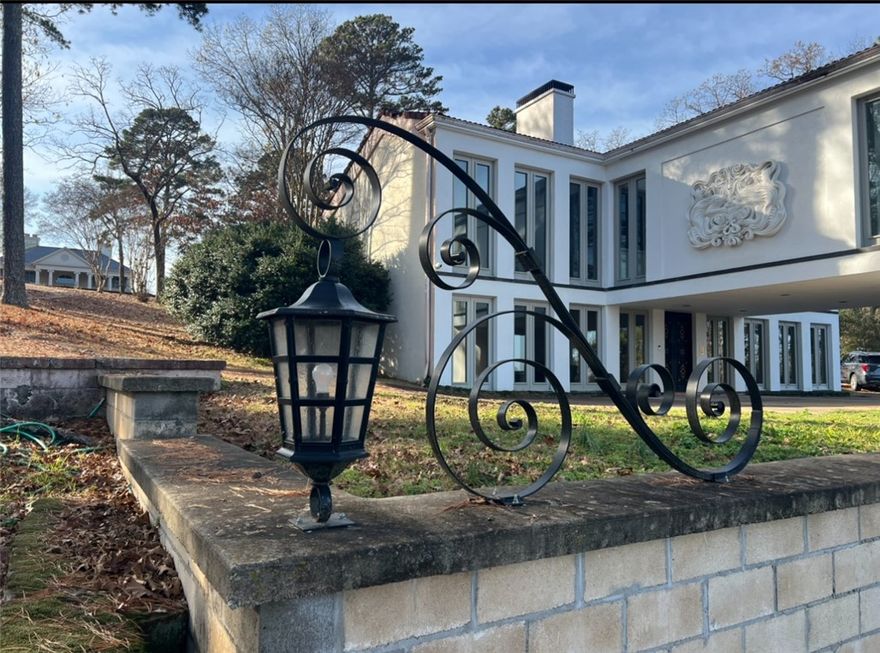One of Russellville's most iconic homes, this Mediterranean Villa has a stunning view of Russellville. It boasts a 1.6 acre lot, with an expanse of lawn which is rare for a home with this kind view.  3 Bedrooms/2 Baths, Cathedral Ceilings, a spectacular crystal chandelier, and many other unique features that make is extra special. Tile flooring on the lower level.  The flooring has been removed from the upper level.  All original blueprints will be left with the buyer which include an alternate layout for the primary bath.  There is an allowance for a new roof that will be given at closing!