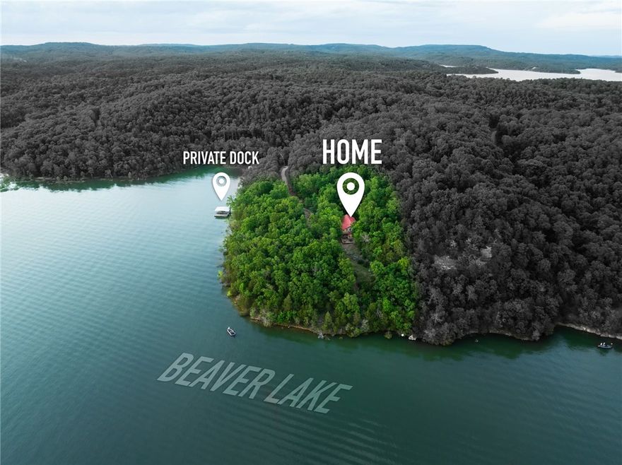 Discover your own slice of paradise on Beaver Lake. This stunning property spans 3,060 square feet and boasts three spacious bedrooms and 2.5 baths, perfectly designed for comfort and convenience. Enjoy the luxury of a generous second-floor flex space, complete with a 15’ x 13’ recreation area & a cozy 15’ x 12’ loft—ideal for an office or additional living space.

Recent upgrades elevate this home, including a new roof on the boat dock with a solar panel, new water lines, and enhanced insulation. The property features a two-slip private boat dock with easy access to lake activities. The slips measure 32’ x 10’ and 24’ x 10’, with the smaller slip equipped with a boat lift.

Revel in the beauty of nature with six acres of seclusion and incredible views from the generous windows throughout the home. Additional highlights include hardwood floors in the common areas, a walk-in pantry, and ample storage space in the garage and bedrooms. A 30x40 steel workshop offers even more room for hobbies, storage, or projects.