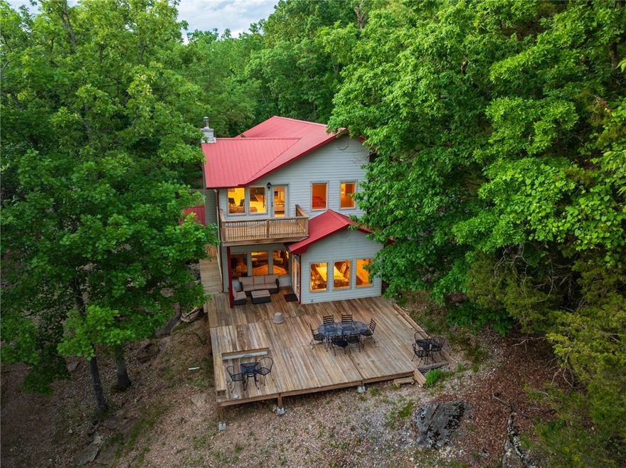 Discover your own slice of paradise on Beaver Lake. This stunning property spans 3,060 square feet and boasts three spacious bedrooms and 2.5 baths, perfectly designed for comfort and convenience. Enjoy the luxury of a generous second-floor flex space, complete with a 15’ x 13’ recreation area & a cozy 15’ x 12’ loft—ideal for an office or additional living space.

Recent upgrades elevate this home, including a new roof on the boat dock with a solar panel, new water lines, and enhanced insulation. The property features a two-slip private boat dock with easy access to lake activities. The slips measure 32’ x 10’ and 24’ x 10’, with the smaller slip equipped with a boat lift.

Revel in the beauty of nature with six acres of seclusion and incredible views from the generous windows throughout the home. Additional highlights include hardwood floors in the common areas, a walk-in pantry, and ample storage space in the garage and bedrooms. A 30x40 steel workshop offers even more room for hobbies, storage, or projects.