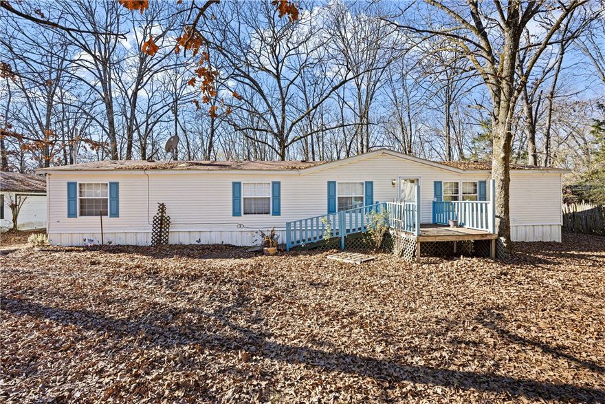 Spacious 3 bed, 2 bath home offering 1,960 sq ft on 3 level acres just outside city limits. Built in 1999, the private primary suite features his-and-her bathrooms with a jetted tub and walk-in shower. Enjoy a screened-in porch and fenced area perfect for goats or other animals. Property includes a huge detached garage/workshop, a detached barn with storage, and 3 unfinished tiny homes with water, septic, and some electric, ideal for Airbnb, guests, or a man cave/she-shed. Three concrete slabs already in place for additional tiny homes. Endless possibilities!