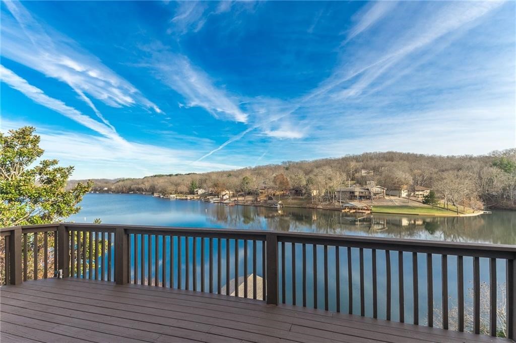 This amazing lake front home was completely remodeled top to bottom in 2020. Enjoy amazing lake front views from almost every room in the house and just steps away from the water. The kitchen was designed for a chef using professional series appliances, tons of cabinets and a huge entertaining island. Gorgeous wood flooring flows throughout the house, including the giant master suite. The master suite features a fireplace, sitting area and a master bath you may never to leave. The remodel included the following features: New roof & gutters, new exterior siding, all new windows, exterior and interior doors, all new flooring, completely new kitchen featuring high end appliances (double oven, large cook top, commercial vent hood, drawer microwave, wine fridge and commercial refrigerator/freezer), all 5 bathrooms were completely redone. The house also features a second downstairs living space with a mini bar. There are simply too many features to list. This house is a absolutely must see!!!