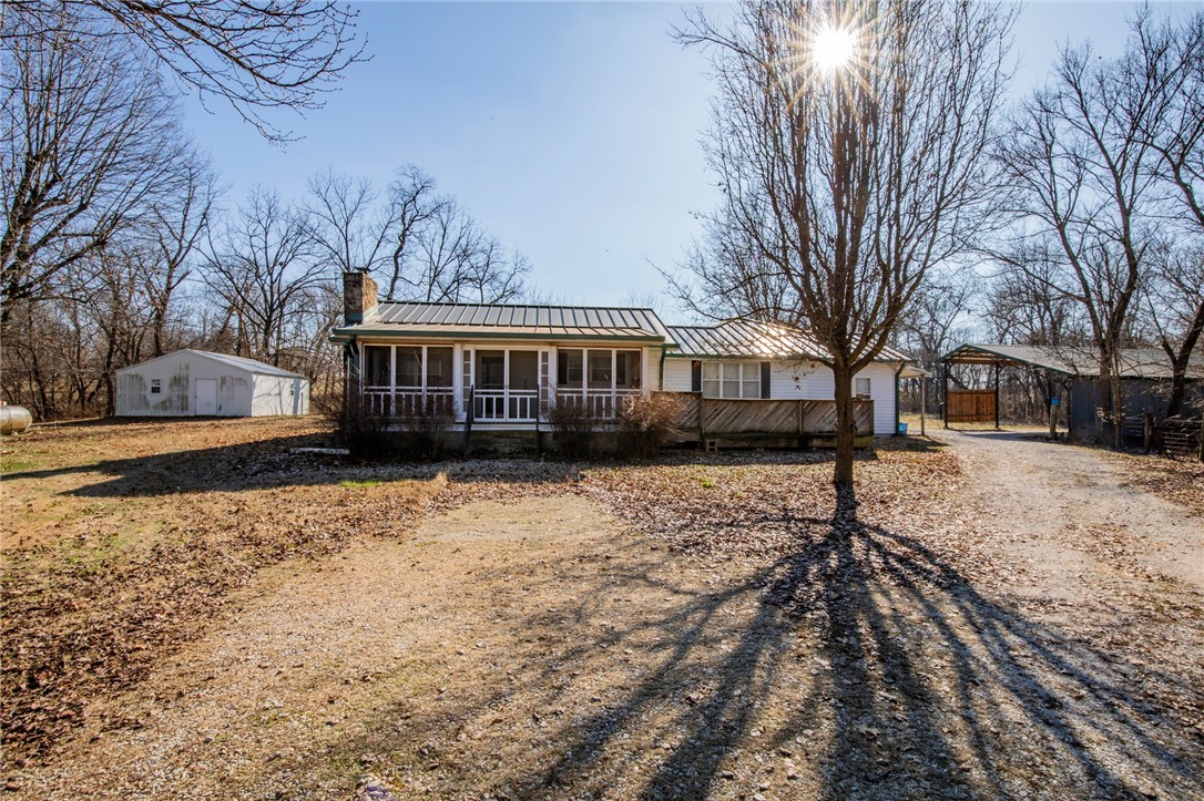 Located in the heart of Northwest Arkansas this property has all kinds of potential. Easy access to I-49. The property consists of 20 (+/-) acres. Would make a nice estate property or could be developed into estate lots. Lots of privacy and room to spread out. The value is in the land. There is currently an older farm house on the property along with two shops and a pole barn. There is a well on the property. The property is in the city limits of Springdale with a Lowell mailing address. Rogers School District.
