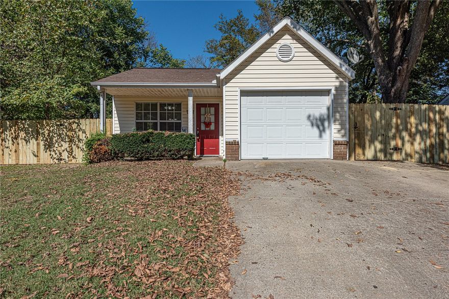 ATTENTION FIRST TIME HOME BUYERS & INVESTORS! This 2 bedroom 2 bathroom home located minutes away from Parks, Shopping, eateries, the University of Arkansas, and  I-49 is just what you’ve been looking for! From the covered front porch head  into the vaulted ceiling living room  featuring luxury vinyl plank flooring  and ceiling fan! Flow into the Galley kitchen featuring  white cabinetry with ample  space, a designated eat-in dining area with chandelier, and tile flooring! Relax and rejuvenate in the primary bedroom with a private ensuite with walk in shower. Enjoy one additional bedrooms and one additional bathroom! Out back enjoy the  large fully fenced in back yard with endless possibilities for outdoor living! Don’t miss Out! Act Now!