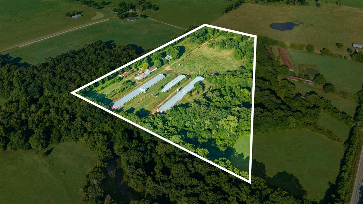 Current Commercial laying hen farm with Handsome Brook birds in place, work the farm until you can't, then tear buildings down...scrap, build a new home or have a small hobby farm! This property is producing an income, 2 working 40x400's already converted. the seller is living in the doublewide (3/3) and the additional living quarters have been stated to be unhabitable (please confirm for yourself). Wells on the property. SEVERAL outbuildings! DO NOT ENTER THE PREMISES - THIS IS BY APPOINTMENT ONLY - BIO SECURITY IS IN PLACE.