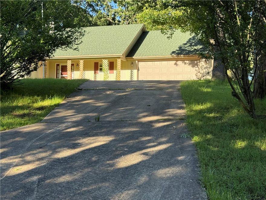 Fresh paint on interior being done now! Whole house generator!Walk to Beaver Lake go fishing.1.52 acres open & wooded.Plenty of room to fence for dogs+have huge garden.Awesome Glassed room!Grow flowers & veggies even in the winter because it's all glass even the ceiling!Cook's delight kitchen oak cabinets lots of them,Counter space goes on & on!Breakfast bar.Nice pantry & more upgrades!Large living room cathedral ceiling w/fan & light. Dining Room looking into backyard perfect place for bird feeders outside the windows.Primary bedroom is good sized has large walk-in closets and a whirlpool tub and walk in shower in bathroom. True Glass Sunroom with hvac, additional area outside for grilling and having all the family and extended family using deck and patio. Tremendous area you could have a garden.Large enough for backyard activities.On the back side of the property are woods so you can enjoy the wildlife & bitd watching!New roof 2022