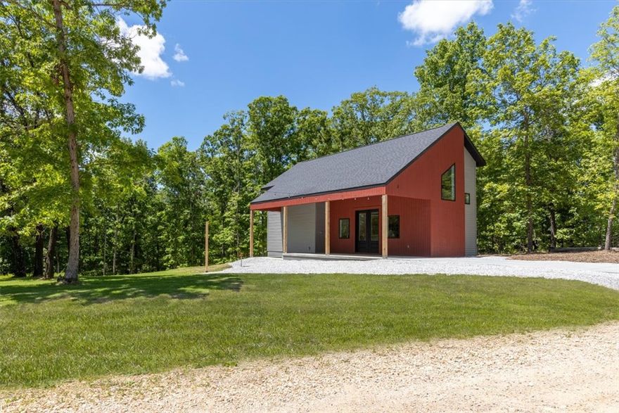 Welcome to this beautifully designed home ideally located near scenic bike trails perfect for outdoor enthusiasts. This thoughtfully crafted property offers a private, peaceful view & a layout that lives larger than its footprint. Step inside to an impressive living area with soaring 17-foot ceilings, creating an open & airy feel. The kitchen is a standout with quartz countertops, soft-close cabinetry, & stainless steel appliances. Durable sealed concrete & luxury vinyl plank flooring run throughout, offering both modern appeal & easy maintenance. Bedrooms include walk-in closets & the home is equipped with full-size washer/dryer hookups for convenience. The HVAC mini split system can be controlled remotely via app or remote by each room, adding comfort and efficiency whether you're home or away. Additional features include party lights out front, dedicated circuit for landscape lighting on photocell & separate circuit ready for hot tub, bike cleaning area. This home combines smart design & quality finishes!