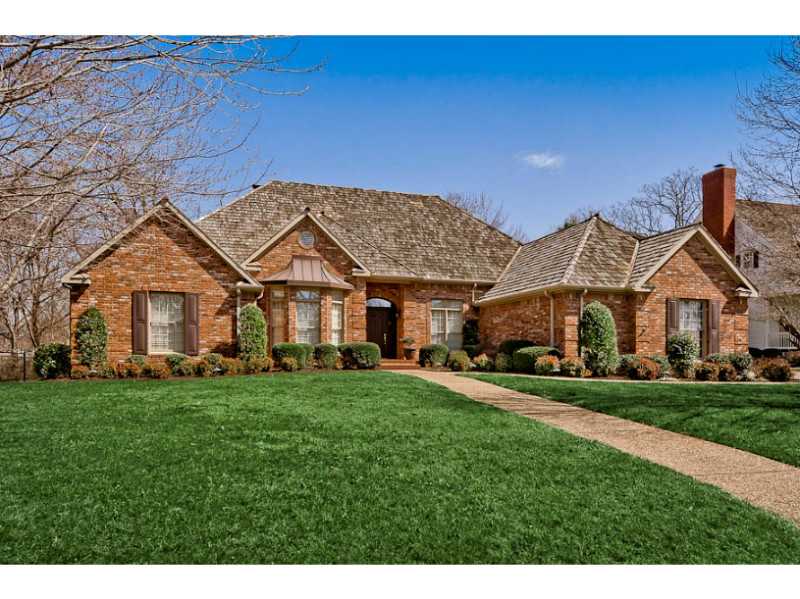 Perfectly situated on Pinnacle Golf Course #2 fairway, this beautiful one-level home offers an elegant retreat close to many of NWA's best venues. The golf course lot, landscaped yard, and brick facade create club appeal. Inside, hardwood floors,generous trim, 11' ceilings and plantation shutters elevate the sophistication level. The kitchen (with custom cabinets, large island, and granite counters) is open to the family room. Lovely views from the screened-in porch and back deck.