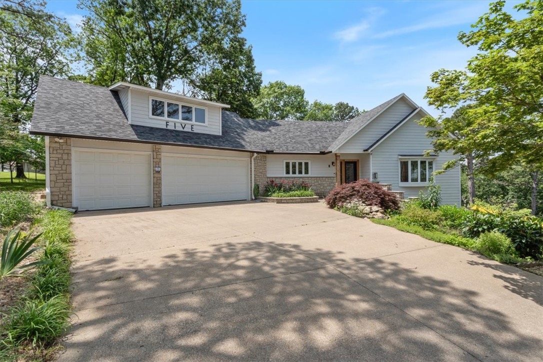 This exquisite custom home features breathtaking views of miles of forested valley & ridgelines at every turn. Situated on a pristine coveted golf course w/resort amenities-Table Rock Lake Marina, public boat launch, trails, pools, golf course, tennis, pickleball. Quality resort living in an elegant, classic, cozy high end home. Comes with 2 lots@.85 acres, sewer w/new lift & 5 zone irrigation on separate meter w/no sewer fees for garden, professionally landscaped. New roof&guttering 2023. Gorgeous sunroom w/H&A overlooking golf course & new paver patio & aluminum fenced back yard. Updates include LVT flooring, carpet, lighting, fans, fixtures, hardware, paint, 2 new walk-in showers, soaker tub, granite counters, ice machine, Bose surround sound, custom entry door. Several beautiful entertaining areas w/newly cleaned & stained decking overlooking fantastic sunsets & nature. Oversized 3 car garage w/workshop & golf cart door, steel beams. Bonus room/office above garage. Safe room. Extra Storage, wet bar, fireplace.