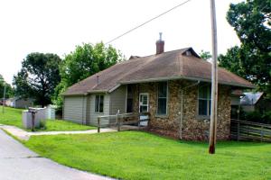 Charming, historical home was once the Train Depot in Bellefonte. It features a nice living room with wood fireplace, a galley style kitchen, two bedrooms, 2 bathrooms, and an additional room located above the carport. This home still features the rock that was used when it was first built, but has had the other addition added recently. This home is a must see! Old but charming! Heat and air unit