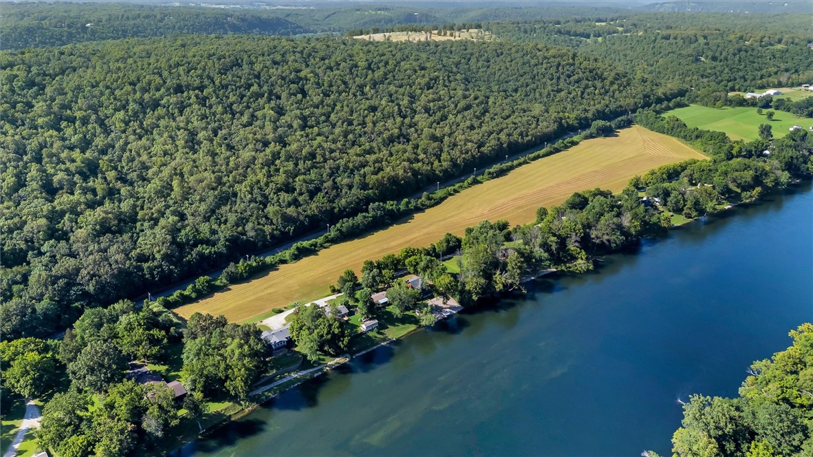 Welcome to an extraordinary 23 ac m/l tract just a few hundred feet from the banks of the world-renowned White River! Perfect for builders, developers, or investors, this rare piece of land offers endless possibilities-from a private estate to a thoughtfully designed river community. Located near public boat ramps & just upstream from the 2nd largest shoal on the Whiter River- accessible only by boat-this property is a dream for trout fishing enthusiasts, nature lovers in the heart of Arkansas's outdoor paradise. Whether you're envisioning a series of custom homes, vacation retreat, or investing in one of the most scenic locations in the area, this land provides unmatched potential & access to world-class outdoor recreation. Don't miss this chance to own a piece of the Ozarks where river legends are made. Your vision starts here!