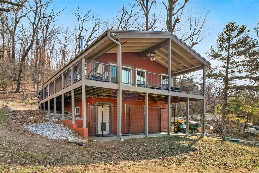 Enjoy the beauty of lakefront living on Beaver Lake in this charming 2-bedroom, 1-bath retreat with breathtaking water views and (2) boat slips. The interior showcases cathedral wood ceilings that enhance the home’s natural charm and open feel. Step outside to the covered deck and take in panoramic lake views year-round. Included are two 8' x 20' boat slips in a community dock a short walk from the house, along with an unfinished 288 sq ft basement storage room for added convenience. Furniture and appliances are included, making this home truly move-in or rental ready. Perfect as a primary residence, weekend escape, or income-producing property, this home captures the essence of lakeside living.