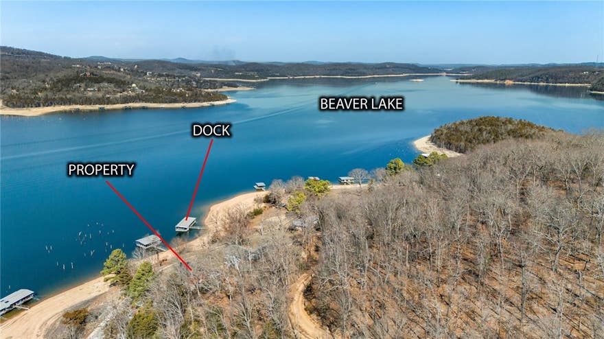 Enjoy the beauty of lakefront living on Beaver Lake in this charming 2-bedroom, 1-bath retreat with breathtaking water views and (2) boat slips. The interior showcases cathedral wood ceilings that enhance the home’s natural charm and open feel. Step outside to the covered deck and take in panoramic lake views year-round. Included are (2) 8' x 20' boat slips in a community dock a short walk from the house, along with an unfinished 288 sq ft basement storage room for added convenience. Most furniture and appliances are included, making this home truly move-in or rental ready. Perfect as a primary residence, weekend escape, or income-producing property, this home captures the essence of lakeside living.