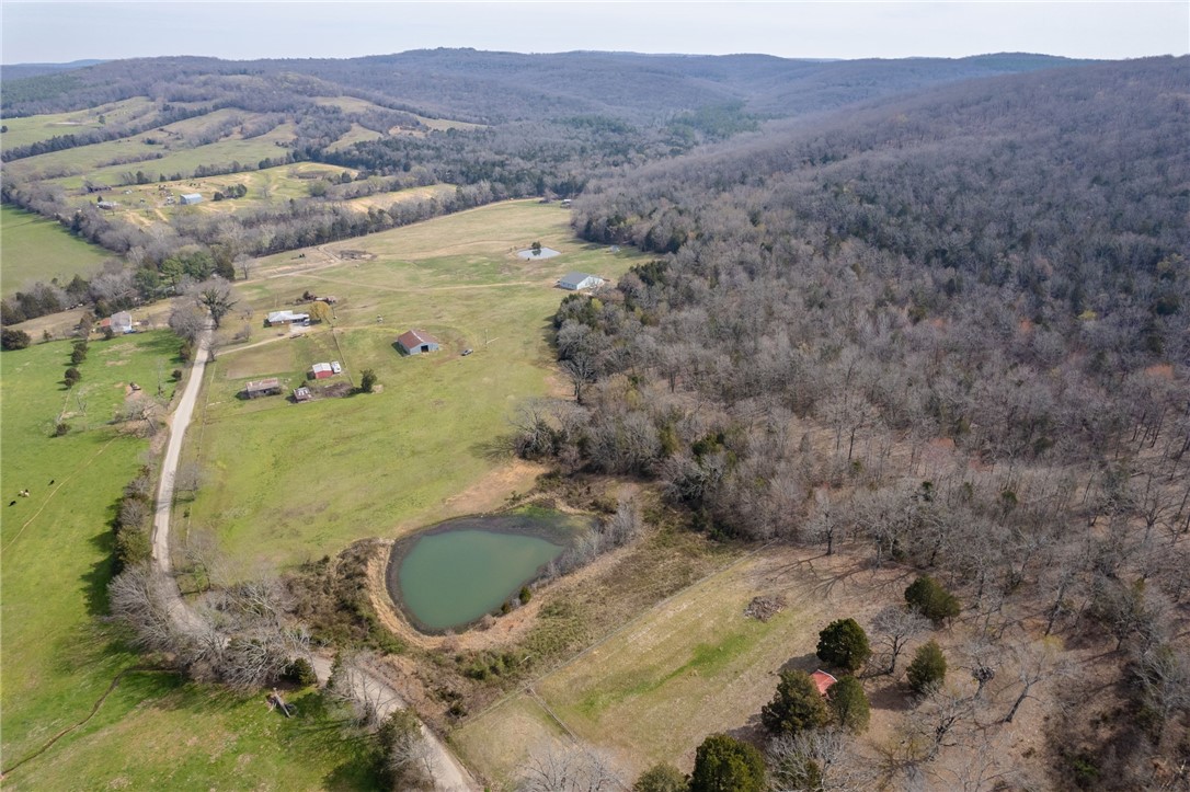 6.77 acres: come home to the country & build your dream home. Nice pond fully stocked with fish. Electric at the street. The 6.77 acres has been split off of a larger parcel, taxes will be determined at closing.