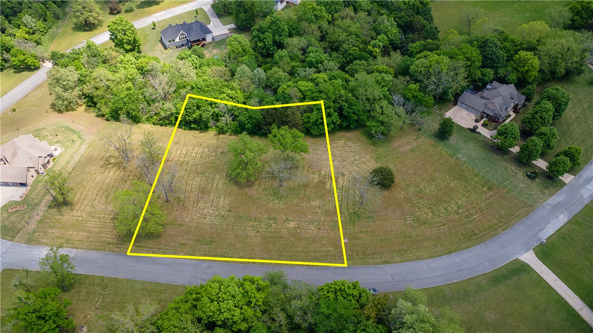 Here’s your chance to build in one of East Fayetteville’s most desirable neighborhoods—The Knolls. This 1.08-acre lot features open, level ground, making it perfect for a variety of home designs. Electric, water, and gas are conveniently available at the street. You'll enjoy a peaceful setting with access to neighborhood amenities, including a pool, tennis and pickleball courts, pool house, and walking trails. A great location, generous space, and the flexibility to build the home you’ve been dreaming of.