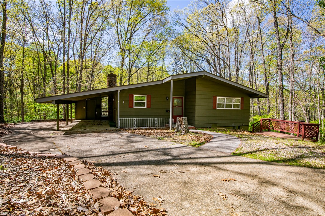 This is a great investment opportunity or starter home. The home is in great shape. Needs updating but could be lived in immediately. Mounting Biking Trails close by. The Back 40 Mountain Biking Trail runs directly behind the house. Large storage area under house, area is very clean and dry. The house is in an estate and is ready for immediate sale. The home is being sold "As-Is". Seller will make no repairs.
