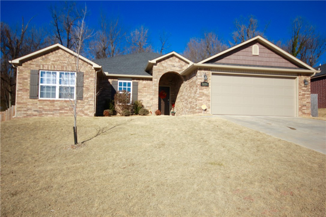 Lovely home in Spring Hill Subdivision. Located just minutes for !-49 and within walking distance to the Razorback Regional Greenway. Newer 3 bedroom 2 bath home with large living area. Kitchen features granite counters, large island and corner pantry. You will enjoy entertaining on the covered back patio with extended deck. Built-in seating for all your guests. Fenced backyard with wooded privacy behind home. Don't delay or this one will be gone.