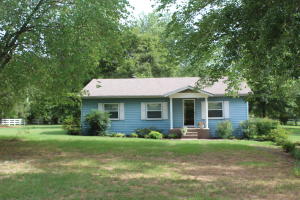 LOCATION,LOCATION,LOCATION! This Country Charmer not only has the perfect location, but the perfect yard with a wet weather creek, a walk-across bridge to get to the large open side yard, plus a park-like setting. The 3 bedroom home is open, clean, and move in ready! There is a large living room, eat in kitchen, and generous sized bedrooms. The covered back deck is so inviting. The yard is immaculate and perfect for these AR seasons. There is rural water, plus an additional well for all the landscaping. There are very few homes in this price range, acreage, and this great condition...get your offer in first! Call me today. Seller will even throw in a One Year Home Warranty!