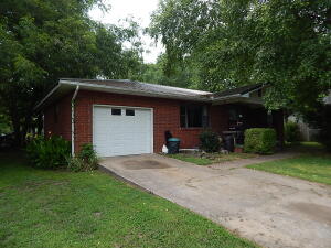 Nice 2BR, 1BA, brick home with one car attached garage with opener, nice shaded lot with big fenced in back yard, covered porch and covered patio, metal roofing in 2019, CHVAC with gas package unit, tile floor in kitchen, laminate in living room, located close to the park in Green Forest.