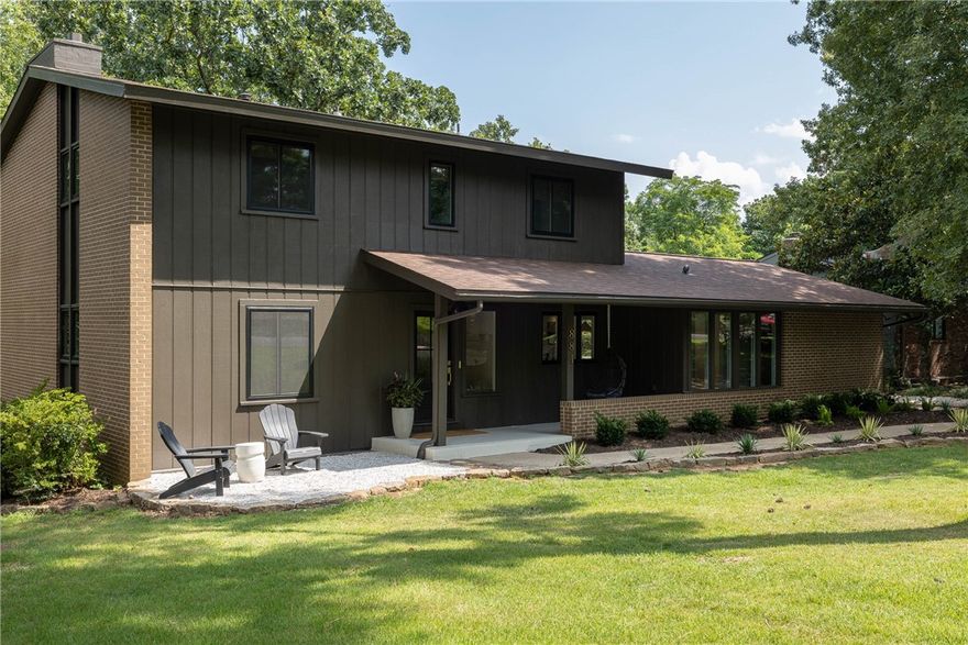 Beautifully renovated mid-century home sitting on top of Mount Sequoyah with treehouse views on a flat, walkable street. 

The design of this home has been completely re-engineered to optimize flow and function. It features an expansive kitchen with an adjacent beverage bar and soapstone countertop. The sunroom is a great dining area located just off of the kitchen. 

There are two large living room spaces each featuring fireplaces. The rooms are flooded with natural light and scenic views. 

The new primary bathroom is spacious with designer finishes and the powder bath features a hand carved marble sink from Turkey.
 
Enjoy secluded backyard views from two decks or sit by a fire pit under more than 100 string lights.  

The front of house offers outdoor seating and community as the street is mostly accessed by walkers and bikers. It is a downhill walk to Root Elementary with close access to the University and the downtown historical district.

Welcome to a great location in the heart of Mt. Sequoyah!