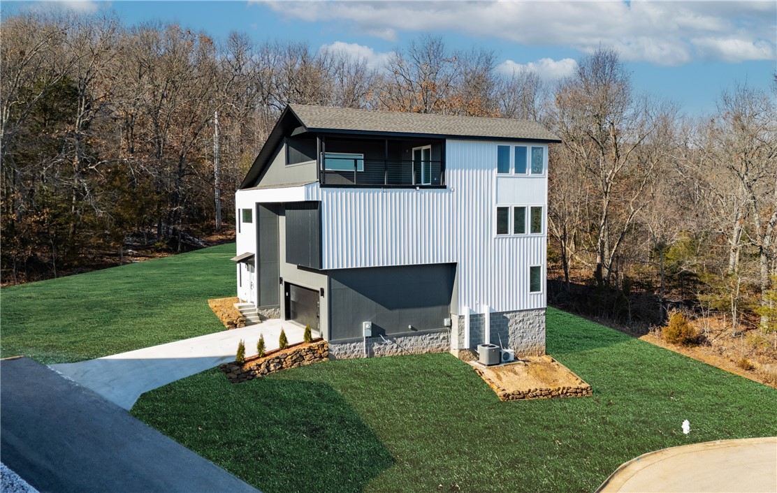 Check out this newly constructed home in prime South Fayetteville! Located near trails, schools, and more, this property offers stunning rooftop views that you'll adore. Enjoy features like a 2-car garage with frosted glass doors and opener, a custom landscaped front yard, rooftop terraces, built-in cabinets in the master bedroom, and a gas fireplace in the living area. Inside, the home boasts an open layout with hand-scraped hardwood floors throughout the main living areas, kitchen, and eat-in space. The kitchen is equipped with granite countertops, stainless steel appliances, and a built-in pantry. The master bedroom serves as a serene retreat with breathtaking views, a beautiful bathroom featuring a walk-in shower and double vanity. Additionally, there are large walk-in closets, carpeted guest bedrooms, and laundry hookups. Don't miss out on this amazing home!
