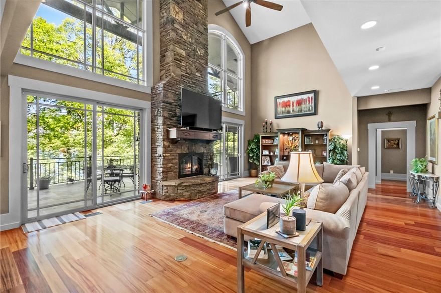 4 SLIP PRIVATE BOAT DOCK and includes 27' Crownline & 2 jet skis with acceptable offer! Discover lakefront living at its finest on Beaver Lake w/this extraordinary retreat nestled on over 3 acres of pristine waterfront property. This stunning residence seamlessly blends rustic charm w/modern luxury, featuring soaring walls of glass that frame breathtaking panoramic lake views. The thoughtfully designed 3-level home offers 5 generous bdrms & 5 baths, connected by a convenient all-level elevator. The heart of the home showcases a gourmet kitchen that flows into multiple entertaining spaces, perfect for celebrations. The primary suite is a private sanctuary, complete w/separate living area/office, 4-season sunrm, spa-inspired bathrm & covered patio overlooking the tranquil waters. Entertainment options abound w/lower-level rec rm featuring its own kitchette & outdoor terrace. Multiple decks, lounging areas & lake-view hot tub create the perfect setting for outdoor living & enjoy the EASY stroll to your private dock.