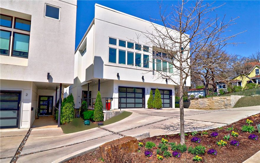 Spectacular home in fabulous downtown! Close to E. Fay Jones Park, community trails & the Ramble. The bright interior is set off with the lg windows that welcome the views of outdoors. Contemporary, vibrant feel w/sleek finishes that accentuate the interior. The spacious living area is open & welcoming w/soaring ceilings, cozy electric/lighted fireplace, well designed kitchen & lovely dining area. The windows have remote control blinds that offer privacy and convenience. Top-of-the-line kitchen appliances enhance the kitchen & there is a large island that is perfect for everyday living, cozy gatherings or dinner parties. The upper level features a wonderful rooftop patio with outdoor kitchen, heater in covered area & great views. Sit & enjoy the magnificent sunsets. Owner’s ste has great views w/large windows & an upscale bathroom w/walk-in shower w/dual body sprays, rain shower heads & Toto commode. Owner’s closet has 3 built chests of drawers. 2-car tandem garage. Easy walk to Theatre Squared, WAC, & Dickson St.