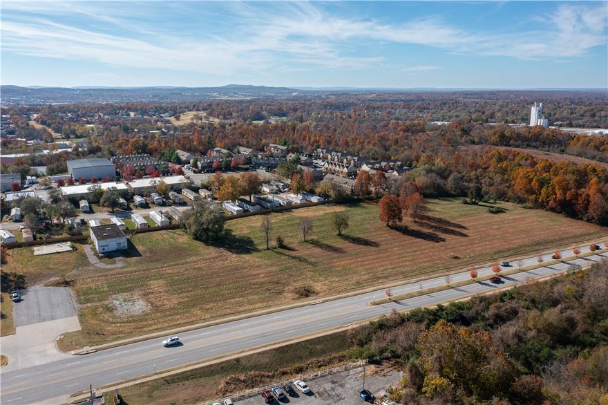 Unlimited Development potential - can divide into requested acreage sizes.  Land wraps around the construction of the new McDonalds.  Currently zoned C-5. Less than a half mile from Tyson world headquarters.
