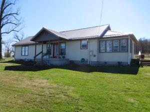 Nicely updated 3 BR, 2 BA home in nice setting w/1.89 acres. New steel siding and gutters. Metal roof, 2 large outbuildings (one heated & cooled), 1 smaller shed, privacy fenced yard. Beautiful kitchen w/stainless appliances, master suite w/walk-in closet and custom tile shower & whirlpool tub. A MUST SEE!