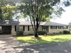 West Russellville home within minutes of Lake Dardanelle and the Marina. 4 bedrooms and 3 full baths, over 2100sqft of spacious living areas with wood burning fireplace, open concept layout, and handicap accessible features. Screened in sun porch overlooking your 2 beautifully landscaped lots on just under an acre in town! BRAND NEW ROOF June 2019.