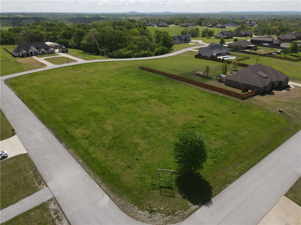 Beautiful 1.66 acre lot ready for your dream home in a well established neighborhood. The lot is level and has plenty of space to build a large home and have space for a pool and/or shop. This property is the best of both worlds, country privacy and feel, yet conveniently located only 5 miles from shopping and restaurants. You are welcome to walk the property.