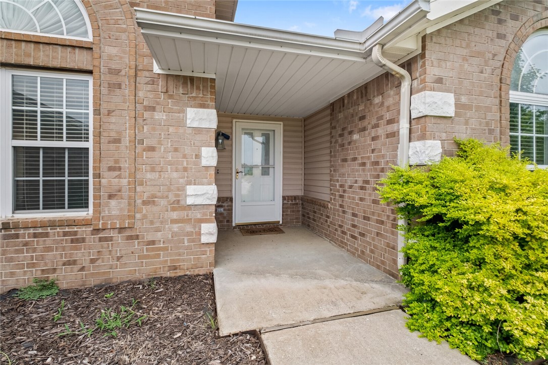 This is it! Situated on an oversized (.30 acre) corner lot in Bentonville's desirable Windwood subdivision, this updated 3 bedroom, 2 bath home offers 1845 sq ft of living space with an open feel from kitchen, dining, and living room. Built in 2003 and thoughtfully updated, this home features an eat in kitchen, formal dining room, and a side entry garage! You can have your very own staycation paradise, with a newly lined in-ground swimming pool - perfect for entertaining and lots of fun. Recent upgrades include new pool liner (2025), new HVAC system (2022), new garbage disposal (2023), smart thermostat, rain shower in the primary bath, updated showers in both baths. Located just minutes from local schools, parks, and shopping, this home blends comfort, convenience and outdoor enjoyment. Just a short drive to the new Walmart Headquarters campus.