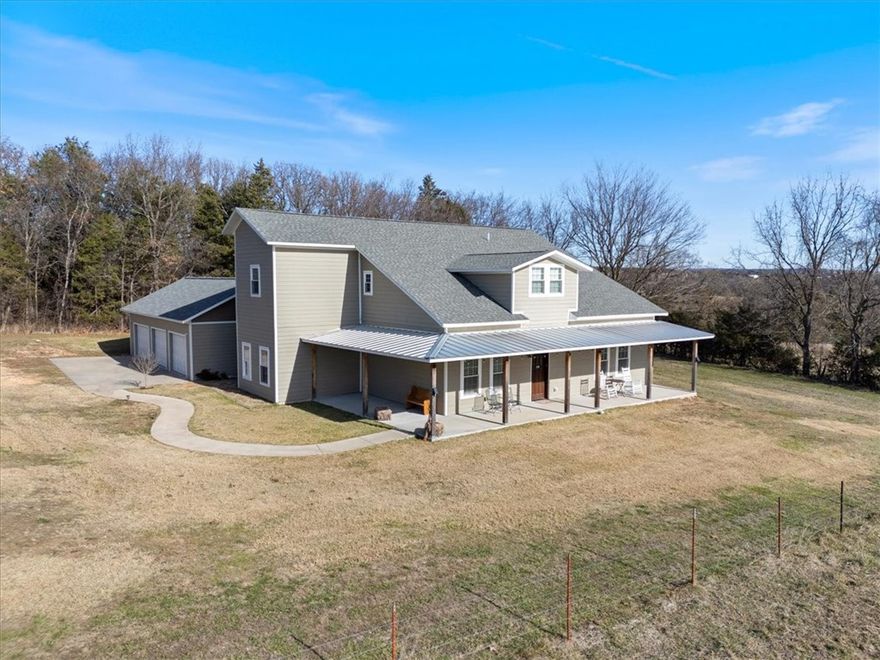 $10,000.00 seller credit at closing with accepted contract! Welcome to country living in this 4–5-bedroom home. Tucked away in the corner of an old family farm, this spacious home—built like a battleship with countless unique features—offers a permanent getaway for a retired couple or a growing family. At 4,600 sq ft, with an upstairs that is like a separate living unit (perfect for homeschool space), this home sits on a large .73-acre lot, and has six-inch exterior walls, deluxe insulation, a 1000 sq ft patio that is totally private from any direction, and an over-sized three-car garage. Four bedrooms, an office space/fifth bedroom upstairs, and a movie-lover’s library, complete with gorgeous tin ceiling. Huge master suite. Wood and tile throughout the house. Giant kitchen with locally made custom cabinets. Few neighbors, surrounded by rolling pastures, woods, and a breathtaking view of the Ozark Mountains off the front porch. This home is located between tourist meccas Eureka Springs and Branson, Missouri.