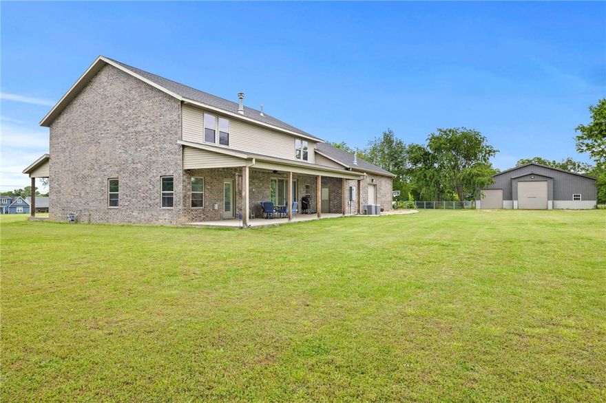 Check out this beautiful 5-acre property in a prime location on Bethel Blacktop in Farmington! This spacious 3,330 sq. ft. home features an oversized kitchen island, generous living areas, a downstairs primary suite with walk-in closet, and four bedrooms upstairs plus a versatile flex space. The oversized 3-car garage offers plenty of room for vehicles and storage. The 2,400 sq. ft. shop is spray foam insulated and equipped with both a 14-foot and 12-foot garage door, making it ideal for hobbies, equipment, RV storage, or a workshop setup. Enjoy the perfect combination of space, functionality, and convenience in a desirable location!