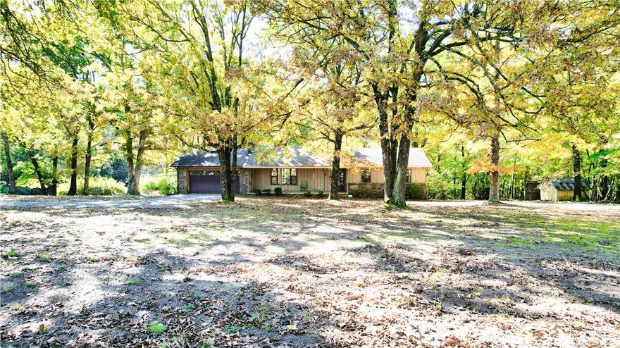 Opportunity awaits on this beautiful 5.5-acre property nestled in one of Fayetteville’s most scenic areas. The land offers the perfect balance of open, partially cleared space and serene wooded surroundings — a rare combination that provides both privacy and natural beauty. The existing home is in need of remodeling and updates, making it an ideal project for someone ready to bring new life to the property. For those looking to build new, this expansive tract offers an exceptional home site with plenty of room for a custom residence, outbuildings, or simply enjoying the peace of nature.
Much of the value here lies in the land itself — a gorgeous piece of Northwest Arkansas countryside just minutes from all the amenities, schools, and conveniences of Fayetteville.
Come envision the possibilities at 5943 W Wheeler Road — whether you restore the current home or build your dream home from the ground up, this property is full of potential.