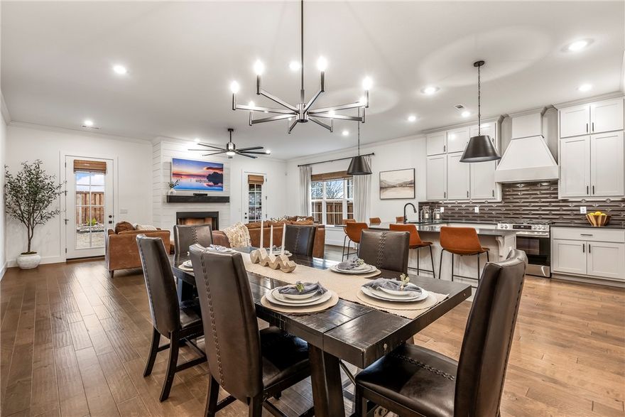 This stunning, move-in-ready home offers comfort, style, and unbeatable convenience. Featuring an open-concept layout, spacious living areas, and abundant natural light, this home is designed for both everyday living and entertaining. The kitchen showcases quality finishes, ample cabinetry, and a seamless flow into the dining and living spaces. The private primary suite provides a relaxing retreat, while additional bedrooms offer flexibility for guests or a home office. Enjoy outdoor living with a welcoming backyard and a fully landscaped yard complete with a sprinkler and irrigation system throughout, keeping everything lush and green year-round. Located just minutes from Walmart Home Office and the new campus, and in very close proximity to J.B. Hunt and Tyson Foods. Also near the NWA bike trail system, offering easy access to miles of scenic riding and outdoor recreation. Aurora Subdivision features one of the nicest pools and clubhouses in NWA, included with the amazing POA, which also covers internet.