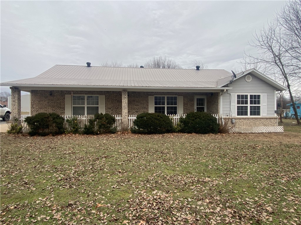 This modest ranch style home has everything needed to plug into small town living! Recently updated with new carpet, vinyl plank flooring and paint. Fenced back yard with trees for the kiddos to climb, shop for Dad's junk and Mom's Pinterest projects. Extra lot with shed, build an in-law studio appt, maybe grow a market garden and have a road side vegetable stand. Get some laying hens and cash in on the egg shortage, let the creative juices flow! Up stairs bonus room has half bath, use it as a bedroom or class room. Maintenance free exterior. 3 season sunroom back porch w/ a covered spot for the grill. Whole house ducted wood stove in garage, store the wood inside and stoke the fire without getting rained on!! Walk in shower in master bath. Buyer to satisfy themselves about their future plans for the extra lot.