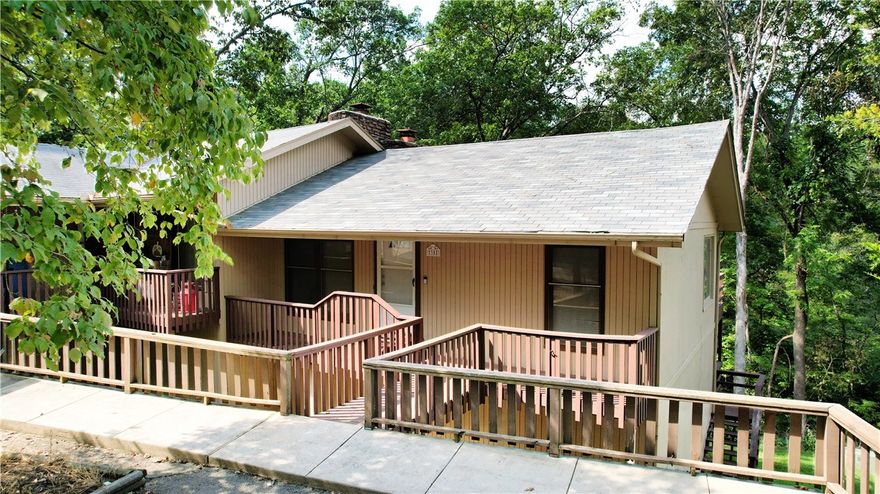 Discover the charm of Bella Vista living in this inviting townhome with a new roof (2023) and a new dishwasher (2024). Nestled in a peaceful setting, this home offers both comfort and convenience along with having two decks for relaxing outdoors while viewing wildlife and enjoying the creek below. Enjoy being moments away from world-class mountain biking trails (such as Tunnel Vision), golf courses (like the premier Bella Vista Country Club Golf Course), nearby recreation center and local shops and businesses. Inside you will find a functional layout with 2 bedrooms with beautiful natural wood ceilings and 1.5 baths. Welcome to your retreat! Storage space below townhome. Bedrooms on lower level. Refrigerator conveys.