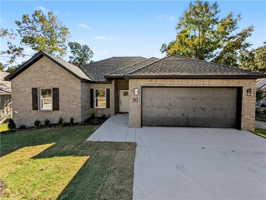 Welcome To Your Next Home! This Stunning New Construction Delivers That “Wow” Factor You’ve Been Waiting For—Tucked Into A Beautiful, Wooded Setting With Mature Trees Out Back, But Still Just Minutes From The Interstate. Prime Bella Vista Location! Hit The Branchwood Nature Trail Or Tee Off At Nearby Highlands Or Scotsdale Golf Courses. Want Lake Life? Lake Loch Lomond And Tiree Park/Boat Launch Are Also Close By! Step Inside To Find A Vaulted Living Room, 9 Ft Ceilings In All Other Areas, Custom Cabinets With Granite Tops, A Stylish Kitchen With Bar Seating And Eat-In Space, And An Open Living Area Anchored By A Cozy Fireplace. The Primary Suite Features A Walk-In Closet, Dual Vanity, And A Custom Tile Shower In The Primary Bath. Split Floorplan. The Front Room Makes The Perfect Office, Bonus Room, Hobby Room, Etc. Chill On Your Covered Back Deck And Soak In The Natural Vibes. **Finished pics of same plan different build. UC this build **Deeded As A 2-Bedroom Septic. 3rd Room To Be Considered Non-Sleeping Room.