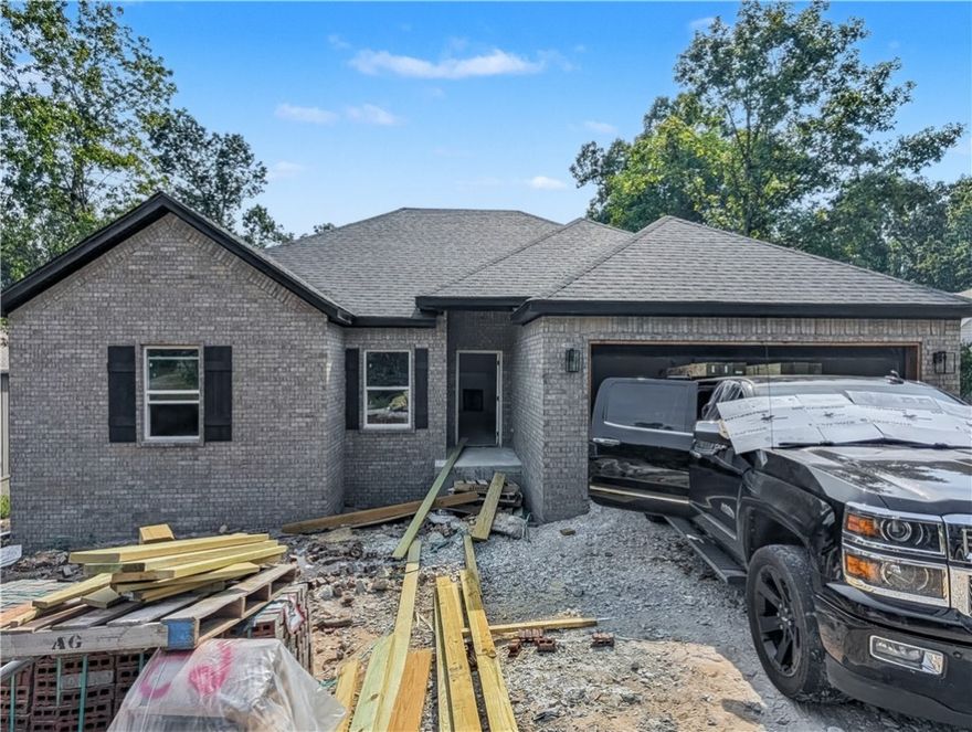 Welcome To Your Next Home! This Stunning New Construction Delivers That “Wow” Factor You’ve Been Waiting For—Tucked Into A Beautiful, Wooded Setting With Mature Trees Out Back, But Still Just Minutes From The Interstate. Prime Bella Vista Location! Hit The Branchwood Nature Trail Or Tee Off At Nearby Highlands Or Scotsdale Golf Courses. Want Lake Life? Lake Loch Lomond And Tiree Park/Boat Launch Are Also Close By! Step Inside To Find A Vaulted Living Room, 9 Ft Ceilings In All Other Areas, Custom Cabinets With Granite Tops, A Stylish Kitchen With Bar Seating And Eat-In Space, And An Open Living Area Anchored By A Cozy Fireplace. The Primary Suite Features A Walk-In Closet, Dual Vanity, And A Custom Tile Shower In The Primary Bath. Split Floorplan. The Front Room Makes The Perfect Office, Bonus Room, Hobby Room, Etc. Chill On Your Covered Back Deck And Soak In The Natural Vibes. **Finished pics of same plan different build. UC this build **Deeded As A 2-Bedroom Septic. 3rd Room To Be Considered Non-Sleeping Room.