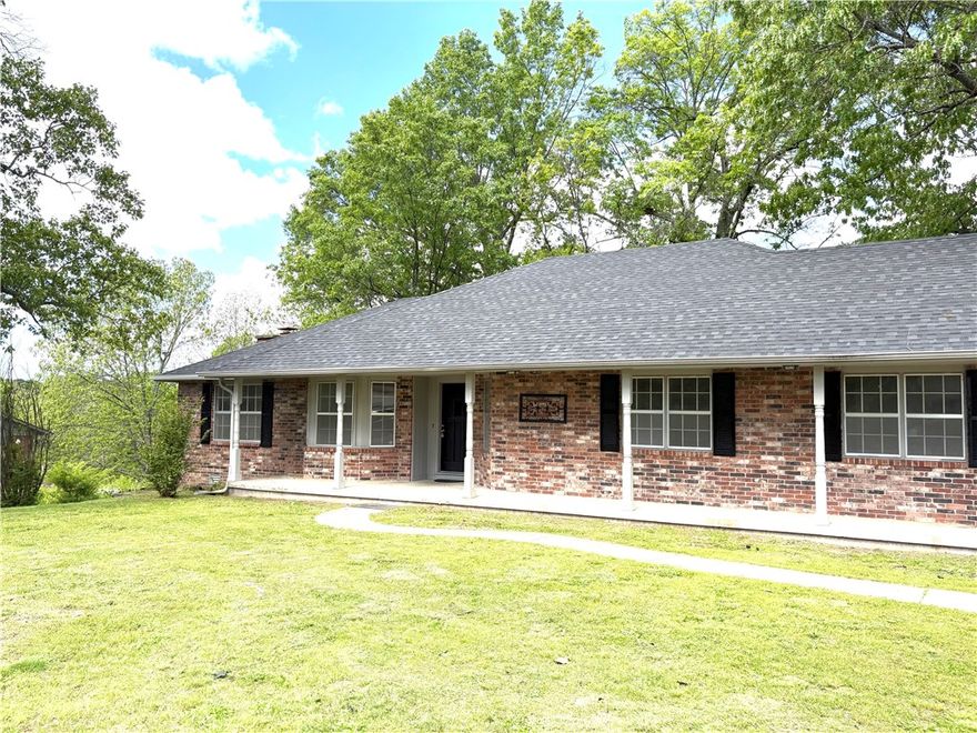 Nice two level brick home in a gorgeous area close to the lake. Four bedrooms and 2 full baths ,giant living room with fireplace, kitchen ,dining room and laundry room all up stairs. The downstairs basement has a large open area,half bath and smaller L shaped room. Upper porch and lower deck with beautiful views of the wooded backyard with an amazing sunset. Deer, squirrels and plenty of birds for enjoyment in this quiet location.
New roof on 4/10/2025, new garage door opener, all new toilets ,fresh paint throughout, new tub/shower in master bath, all new new faucets, all new light switches and plug ins . 
Back porch has three doors into the house(living room Double doors,dining room and laundry room). 
Extra large Double door garage with walk through door to front porch.  Has gas piped to the garage to install heater -never been used. Full attic for storage,