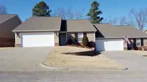 Very nice and well kept condo. Owner has added many extras such as extra large patio, wrought iron fence, nice gas fireplace stove (vented) in living room & shutters. Comes with all kitchen appliances. Country atmosphere with pasture in back. Single level with not steps. HOA fee is $110/mo. Sprinkler system. Sq. footage per assessor. Agents see private remarks.