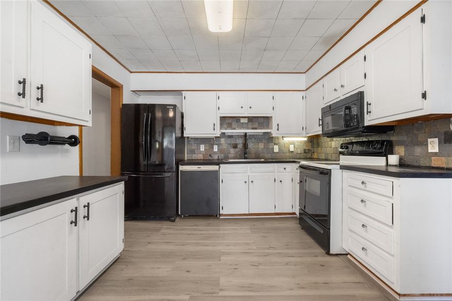 This spacious 3-bedroom, 2-bath home offers a great blend of comfort and opportunity—with the
possibility of a fourth bedroom. Updated flooring and fresh paint in parts of the home, it's easy to move
right in and make it your own over time. The layout features generous living areas and a practical flow
throughout. One of the standout features is a separate area with existing plumbing—ideal for creating a
guest suite, in-law quarters, private office, or creative workspace. Whether you need room to grow or
you're looking for flexible options, this property is full of potential. Come take a look and picture how
you'd make it yours!