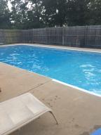 This home offers so much for so little! 3 bedrooms and 2 full bath! Cozy large living room with fireplace! POOL in back with covered porch, perfect for entertaining while kiddos swim. 3+/- ACRES which will allow plenty of privacy and outdoor fun! Oodles of potential for only $75,000!*Pool will be opened soon!*Mineral rights do not convey.