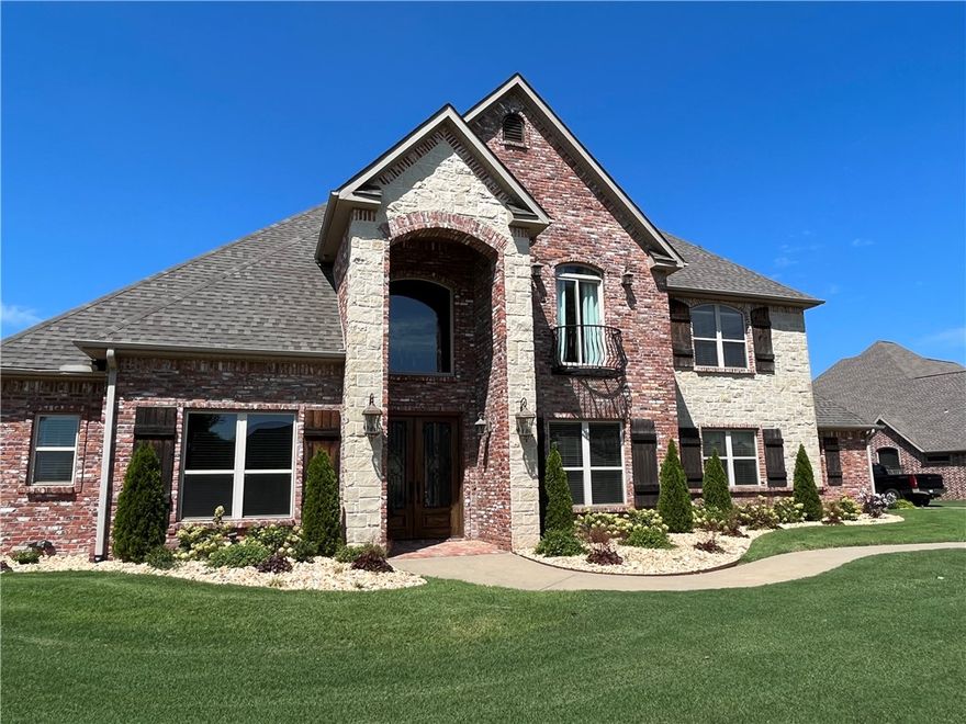 With quick access to I49 and XNA, this home in Oak Tree makes life a lot simpler.  Like taking your morning 5 mile walk or run on the sidewalk that runs throughout the entire neighborhood?  Walk to the Clubhouse for your workout.  A Grand entry with soaring ceilings, a wood staircase with wrought iron railing and hand scraped hard wood floors will wow you and all your guests.  In the chef’s kitchen you can channel your inner Gordon Ramsey.  Imagine all the holidays, birthdays and parties you could host in this home.  The Primary Bedroom suite offers a luxurious bath, 2 large walk-in closets and plenty of room to create your private haven.  The oversized bonus room provides a great space for all of your favorite people to gather, play and create memories!  Every room in this house offers an abundance of storage and closet space. The large lot will allow room for a pool. Wired for sound throughout the home, garage and patio. Close to Main St and the Mercantile. New Roof 2022. $8000.00 allowance with acceptable offer.