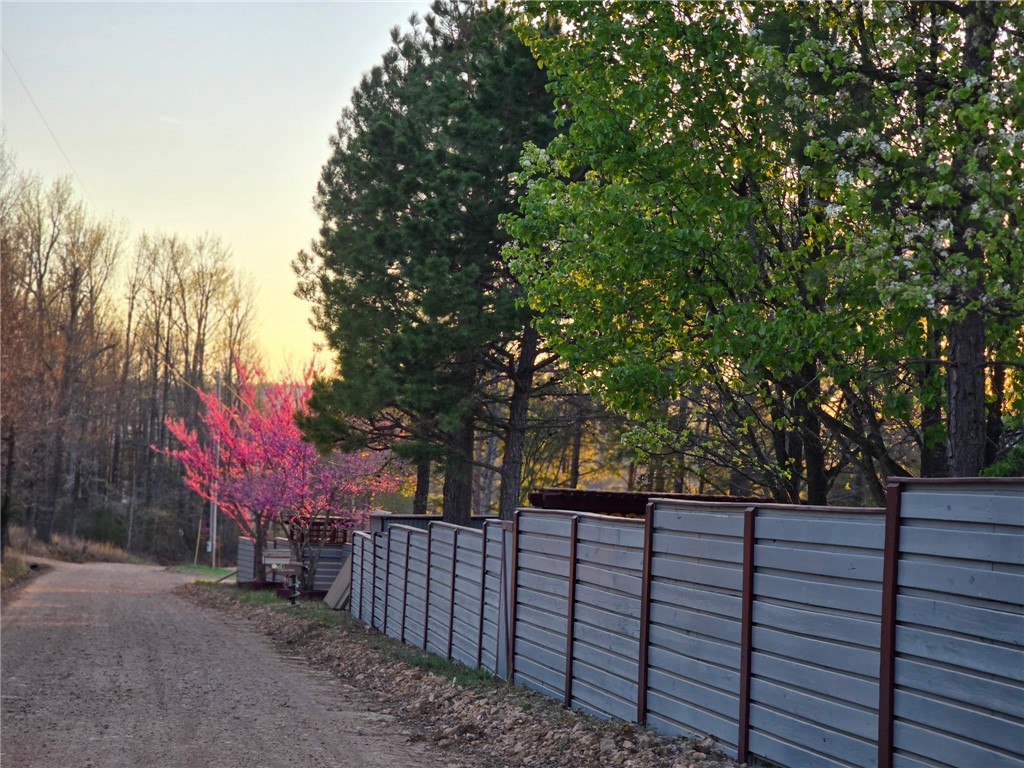 Escape the city, in this serene 2 bed, 2 bath cabin located on 6.2 acres. This property features a shop with mother-in-law quarters, hardwood floors, a separate office space, a wraparound deck,Ā an upstairs balcony and even an indoor swim spa. Conveniently located just a mere 0.8 miles from the Buffalo National River property line, hiking trails, swimming holes, Parker Hickman Farmstead, and Erbie Campground;Ā all while being located on a county road for easy access, with all of the modern amenities already in place! This would make a great location for a STR, or a small hobby farm with plenty of cleared acreage for a garden or animals.