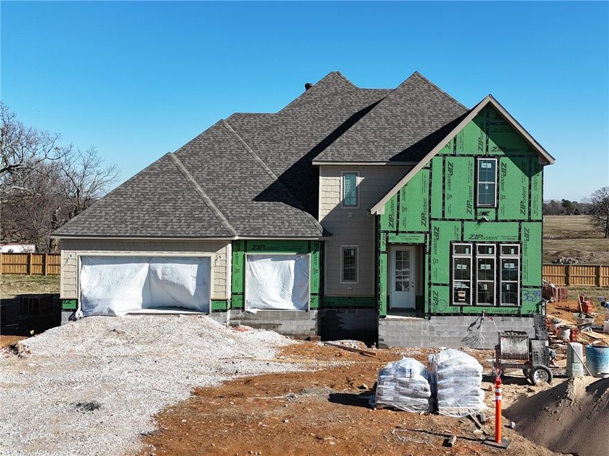 Welcome to County Line Square, a new Springdale community near Shaw Family Park with a pool and pavilion for residents. This home opens into the main living area, creating an inviting first impression. The living space features a fireplace and 3 large windows. From here, the layout flows into the dining area and kitchen, with French doors leading to the covered back patio. The kitchen includes a large island, quartz countertops, and cabinets to the ceiling. Engineered hardwood floors run throughout the first floor. A bedroom sits toward the back of the home with a full bathroom nearby. The primary suite features a vaulted ceiling, a bathroom with a double vanity and centered makeup vanity, a walk-in shower, and a walk-in closet that connects to the laundry room. A mudroom and 3-car garage are also located on the main level. Upstairs offers 3 bedrooms and a full bathroom. A fence, blinds, and gutters are included. Builder’s preferred lender is offering $3500 toward closing costs or a rate buy down. *Agent Owned*