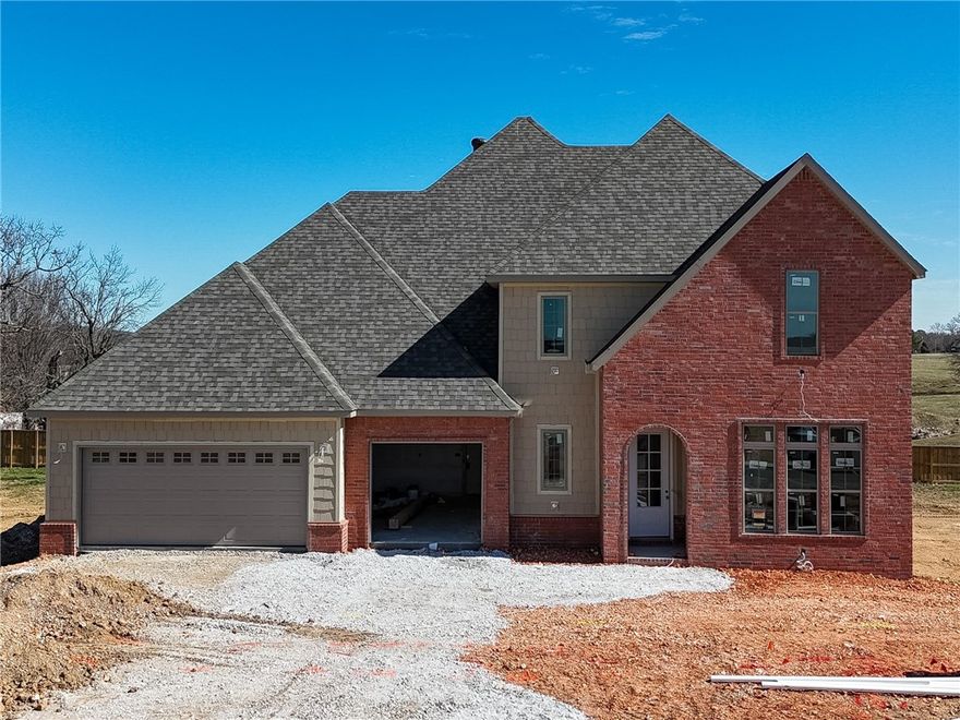 Welcome to County Line Square, a new Springdale community near Shaw Family Park with a pool and pavilion for residents. This home opens into the main living area, creating an inviting first impression. The living space features a fireplace and 3 large windows. From here, the layout flows into the dining area and kitchen, with French doors leading to the covered back patio. The kitchen includes a large island, quartz countertops, and cabinets to the ceiling. Engineered hardwood floors run throughout the first floor. A bedroom sits toward the back of the home with a full bathroom nearby. The primary suite features a vaulted ceiling, a bathroom with a double vanity and centered makeup vanity, a walk-in shower, and a walk-in closet that connects to the laundry room. A mudroom and 3-car garage are also located on the main level. Upstairs offers 3 bedrooms and a full bathroom. A fence, blinds, and gutters are included. Builder’s preferred lender is offering $3500 toward closing costs or a rate buy down. *Agent Owned*